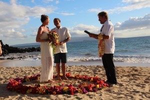Intimate Wedding Ceremony on Maui Beach in Circle of Flowers